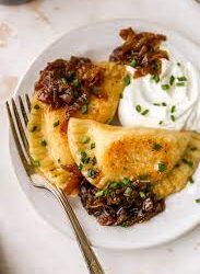 Luck of the Irish- Irish Cheddar Pierogies W/ Guinness Caramelized Onions & Kielbasa